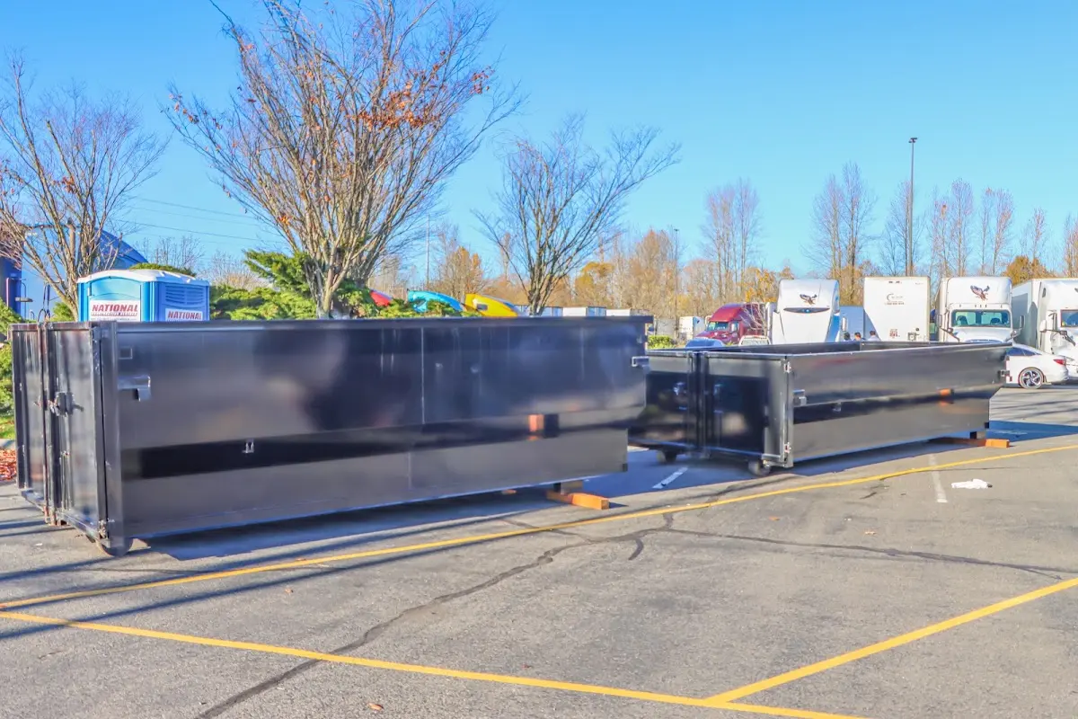 Professional dumpster rental service with roll-off container on residential driveway in Bargersville